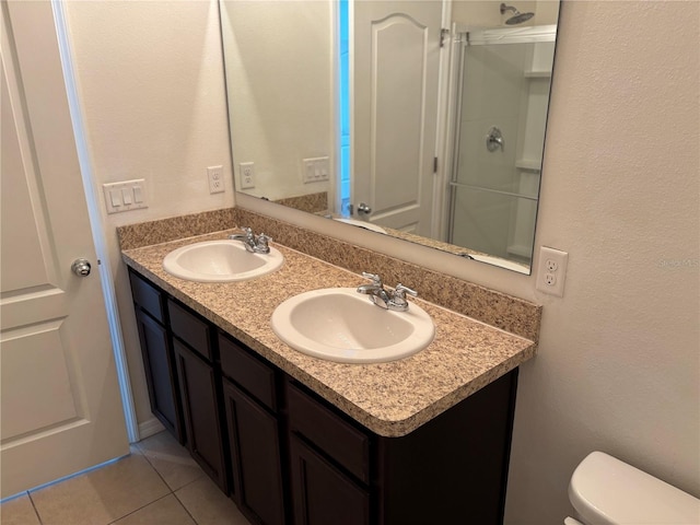 359 Arbor Lakes Dr, Davenport, FL 33896 - bathroom featuring double vanity, tile patterned flooring, a shower, and a textured wall