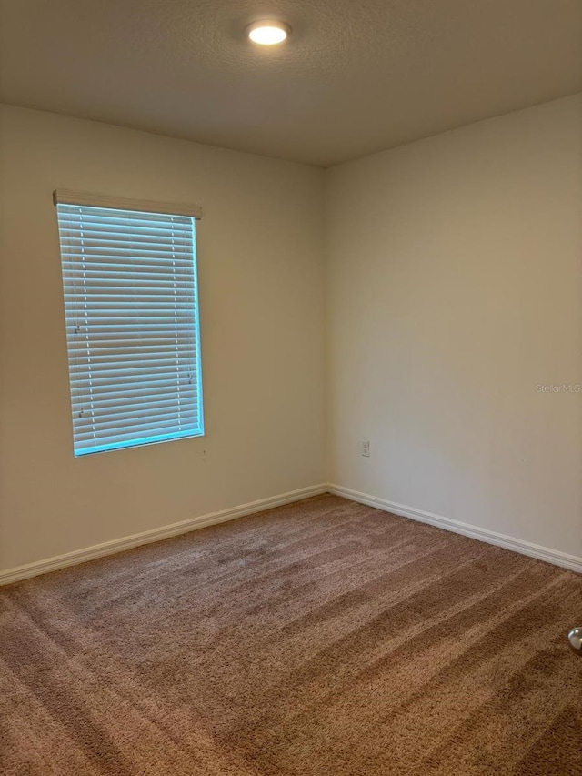 359 Arbor Lakes Dr, Davenport, FL 33896 - carpeted spare room featuring baseboards