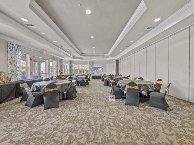 8401 Riverdale Ln Unit 8401, Davenport, FL 33896 - carpeted dining area featuring a tray ceiling, ornamental molding, and recessed lighting