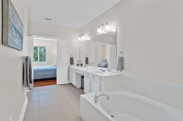 8401 Riverdale Ln Unit 8401, Davenport, FL 33896 - full bath featuring ensuite bathroom, a bath, double vanity, and tile patterned floors