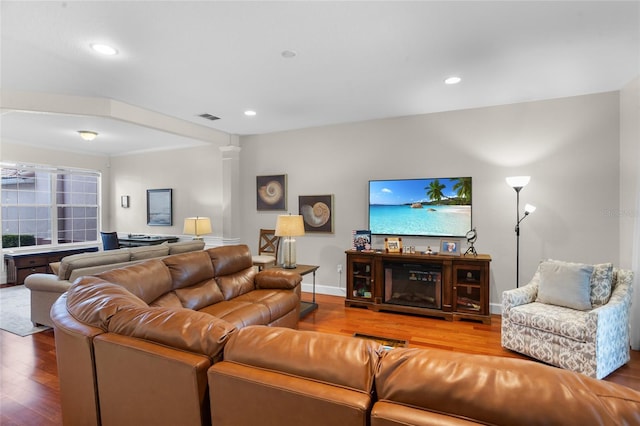 8401 Riverdale Ln Unit 8401, Davenport, FL 33896 - living room featuring wood finished floors, recessed lighting, and decorative columns