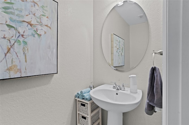 8401 Riverdale Ln Unit 8401, Davenport, FL 33896 - bathroom with a sink and a textured wall
