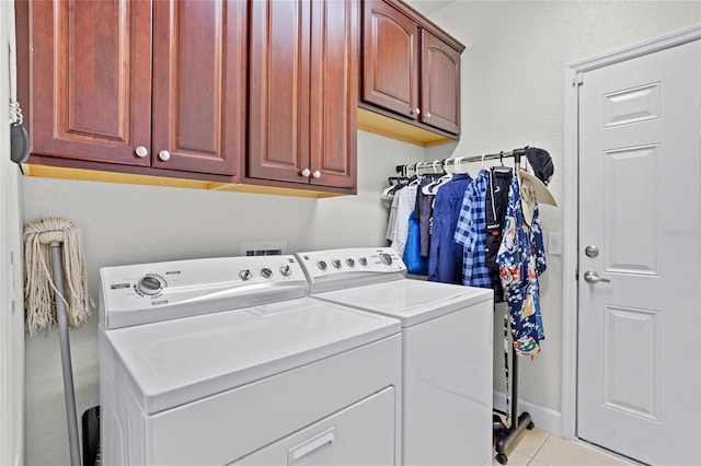 8401 Riverdale Ln Unit 8401, Davenport, FL 33896 - laundry area featuring separate washer and dryer, cabinet space, and tile patterned flooring