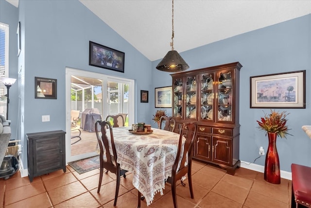 3214 Herons Point Cir, Kissimmee, FL 34741 - dining space featuring light tile patterned flooring and high vaulted ceiling