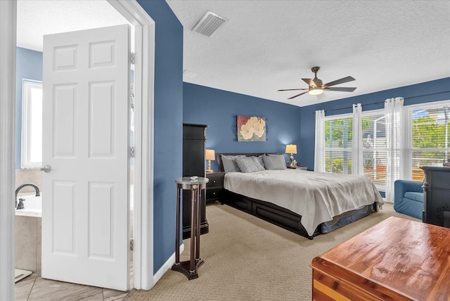 3214 Herons Point Cir, Kissimmee, FL 34741 - carpeted bedroom featuring a textured ceiling and a ceiling fan