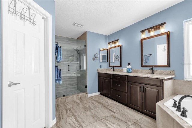 3214 Herons Point Cir, Kissimmee, FL 34741 - full bath with a shower stall, double vanity, a garden tub, a textured ceiling, and marble finish floors