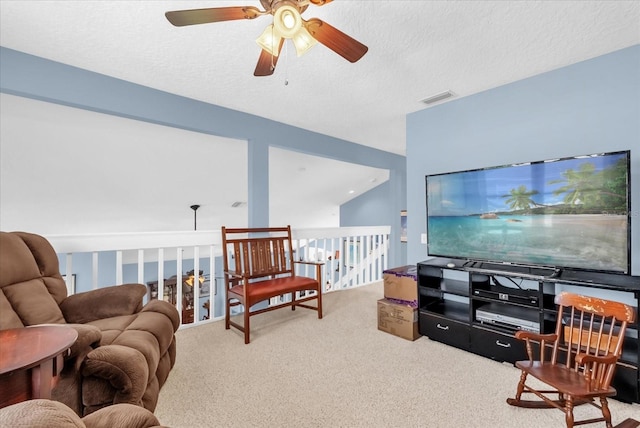 3214 Herons Point Cir, Kissimmee, FL 34741 - carpeted living area with ceiling fan and a textured ceiling
