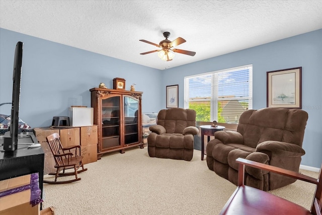 3214 Herons Point Cir, Kissimmee, FL 34741 - living area with carpet floors, a ceiling fan, and a textured ceiling