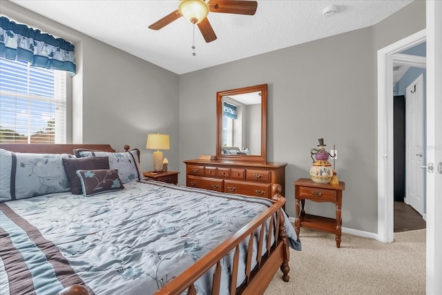 3214 Herons Point Cir, Kissimmee, FL 34741 - bedroom with light colored carpet and ceiling fan