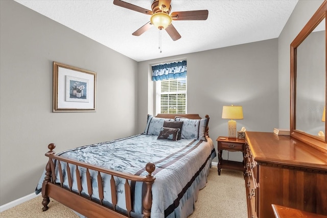 3214 Herons Point Cir, Kissimmee, FL 34741 - bedroom with light carpet, a textured ceiling, and a ceiling fan