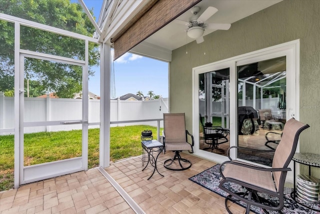 3214 Herons Point Cir, Kissimmee, FL 34741 - sunroom / solarium with ceiling fan and outdoor dining space