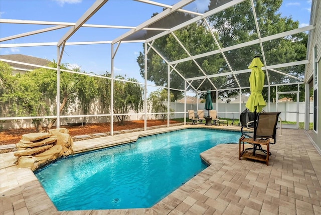 3214 Herons Point Cir, Kissimmee, FL 34741 - view of swimming pool featuring a fenced backyard, a patio area, and a lanai