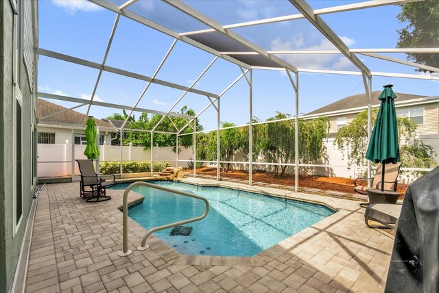 3214 Herons Point Cir, Kissimmee, FL 34741 - view of swimming pool with a patio, a fenced backyard, and glass enclosure