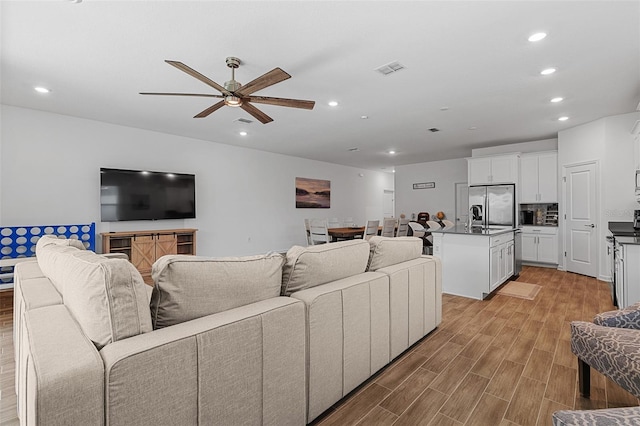 2759 Slash Way, Saint Cloud, FL 34771 - living room with ceiling fan, recessed lighting, and light wood-style floors