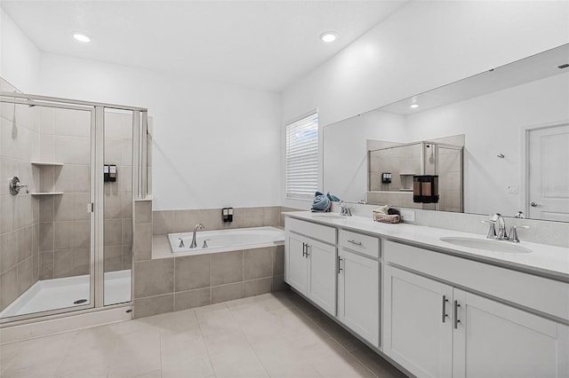 2759 Slash Way, Saint Cloud, FL 34771 - bathroom with double vanity, a shower stall, a bath, tile patterned floors, and recessed lighting