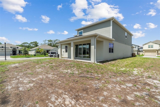 2759 Slash Way, Saint Cloud, FL 34771 - back of property featuring stucco siding and a residential view