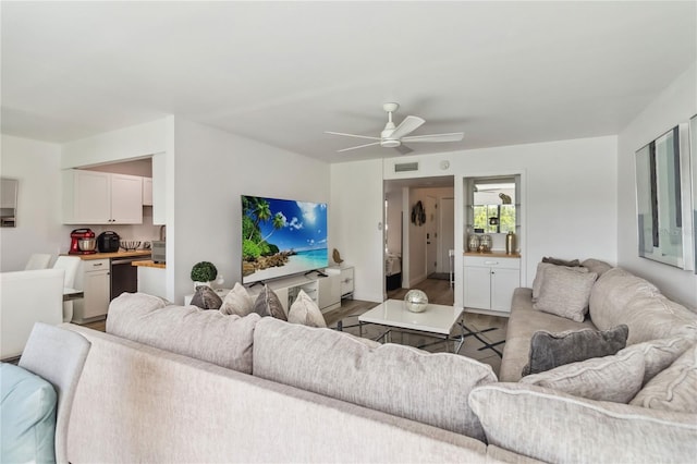 4570 Tower Pine Rd Ge, Unit Ge, Orlando, FL 32839 - living area with wood finished floors and a ceiling fan