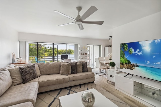 4570 Tower Pine Rd Ge, Unit Ge, Orlando, FL 32839 - living area with wood finished floors, ceiling fan, and healthy amount of natural light