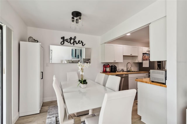 4570 Tower Pine Rd Ge, Unit Ge, Orlando, FL 32839 - dining room featuring light wood-type flooring and recessed lighting