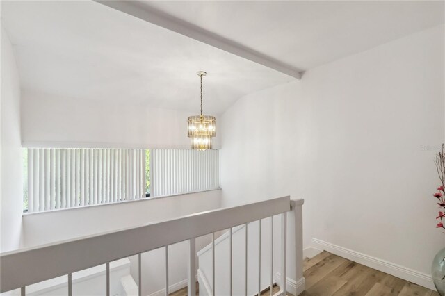4570 Tower Pine Rd Ge, Unit Ge, Orlando, FL 32839 - staircase with wood finished floors, a chandelier, vaulted ceiling, and plenty of natural light