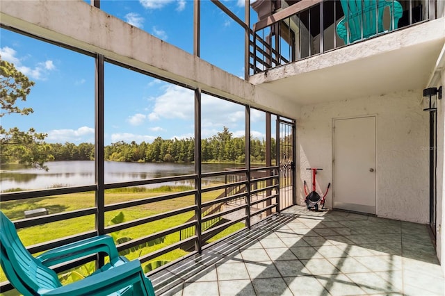 4570 Tower Pine Rd Ge, Unit Ge, Orlando, FL 32839 - unfurnished sunroom featuring a water view