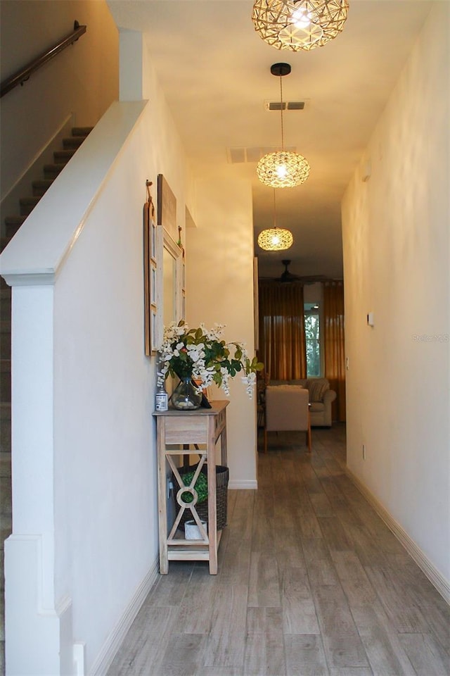 721 Benoi Dr, Davenport, FL 33896 - hallway with light wood-style floors and stairway