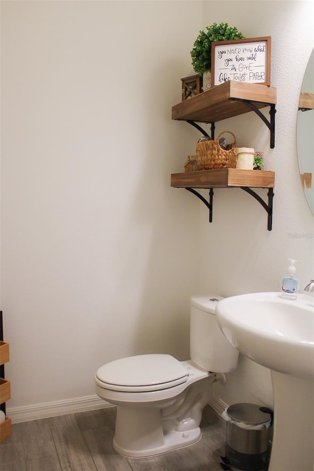 721 Benoi Dr, Davenport, FL 33896 - bathroom featuring toilet and wood finished floors