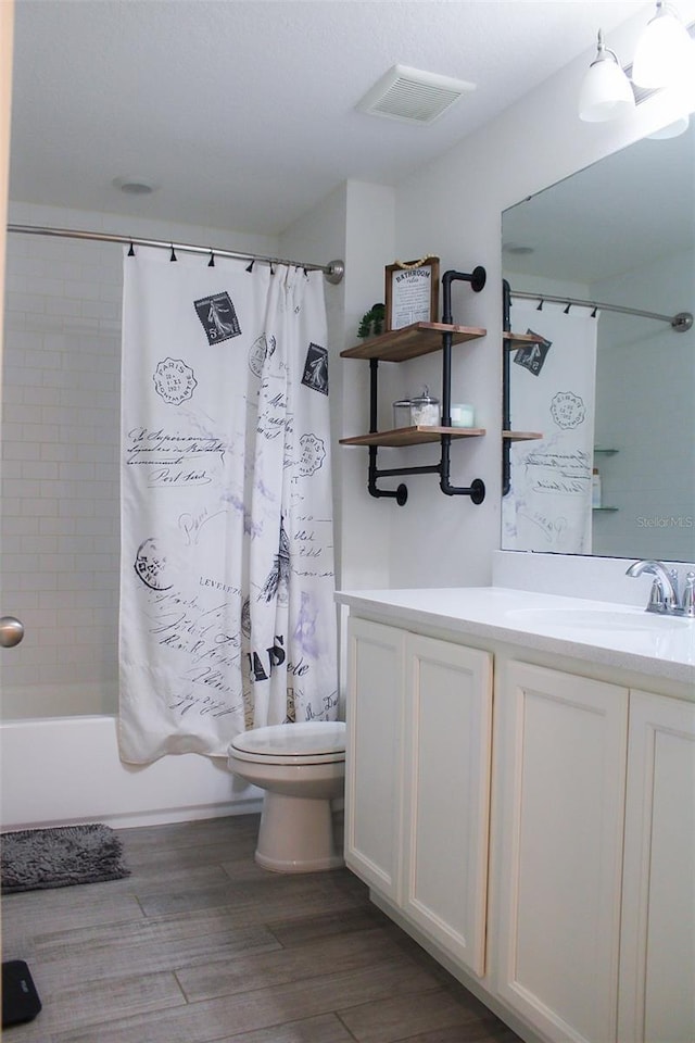 721 Benoi Dr, Davenport, FL 33896 - full bathroom featuring vanity, wood finished floors, and shower / tub combo