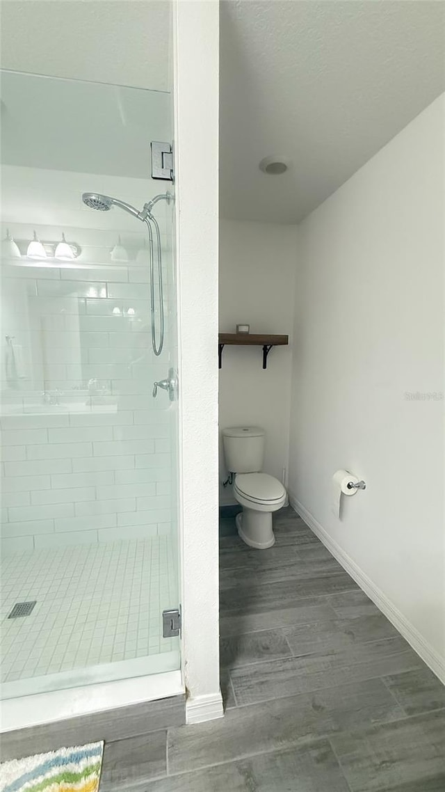 721 Benoi Dr, Davenport, FL 33896 - bathroom with a shower stall and wood finished floors