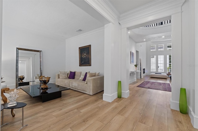 933 Jasmine St, Celebration, FL 34747 - living room with light wood finished floors and ornamental molding