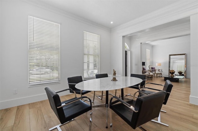 933 Jasmine St, Celebration, FL 34747 - dining room with ornamental molding and light wood-type flooring
