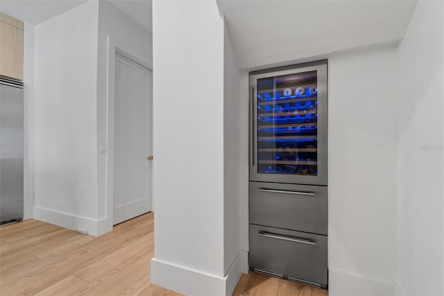 933 Jasmine St, Celebration, FL 34747 - detailed view of wood finished floors, built in fridge, beverage cooler, and fridge