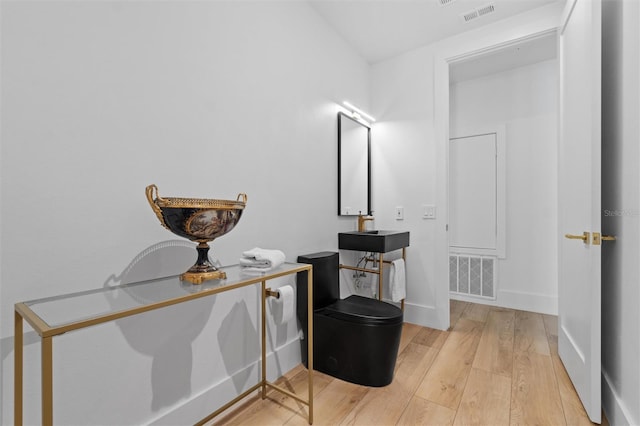 933 Jasmine St, Celebration, FL 34747 - bathroom with wood finished floors and a sink