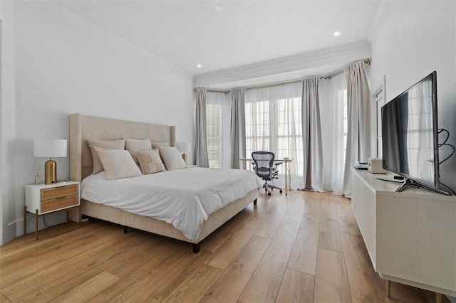 933 Jasmine St, Celebration, FL 34747 - bedroom featuring ornamental molding and light wood-type flooring
