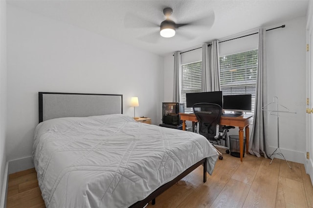 933 Jasmine St, Celebration, FL 34747 - bedroom with wood-type flooring and ceiling fan