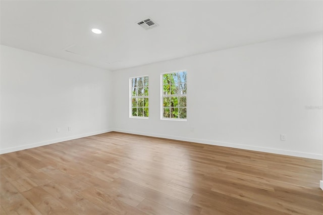 933 Jasmine St, Celebration, FL 34747 - unfurnished room featuring light wood-style flooring and recessed lighting