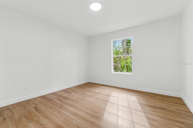 933 Jasmine St, Celebration, FL 34747 - unfurnished room featuring light wood finished floors and baseboards