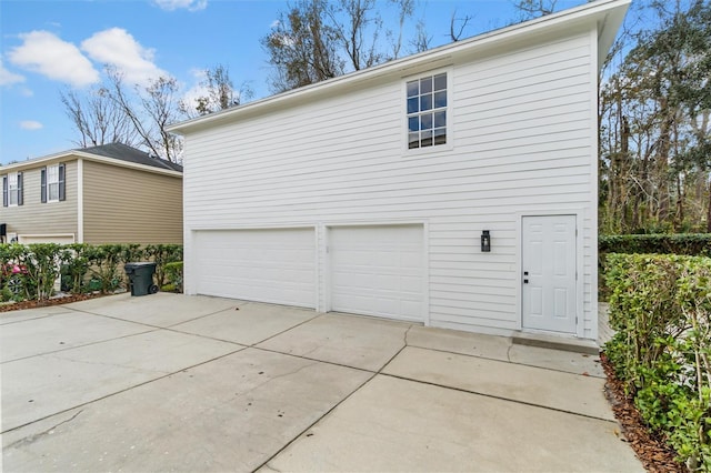 933 Jasmine St, Celebration, FL 34747 - view of home's exterior with an attached garage and driveway