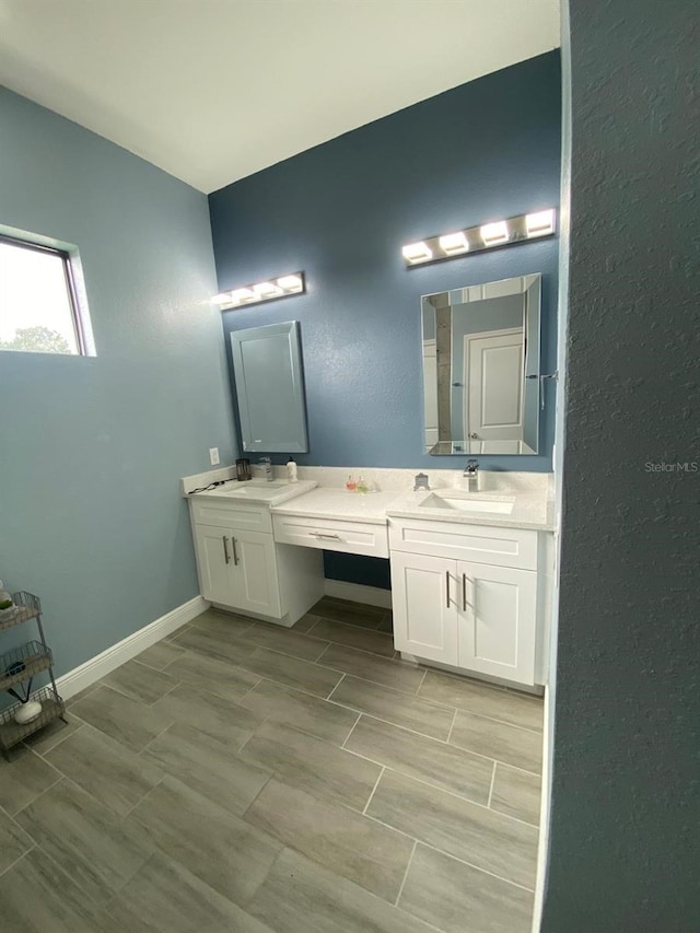 2408 Conroy Ave N, Lehigh Acres, FL 33971 - full bath with double vanity and a textured wall