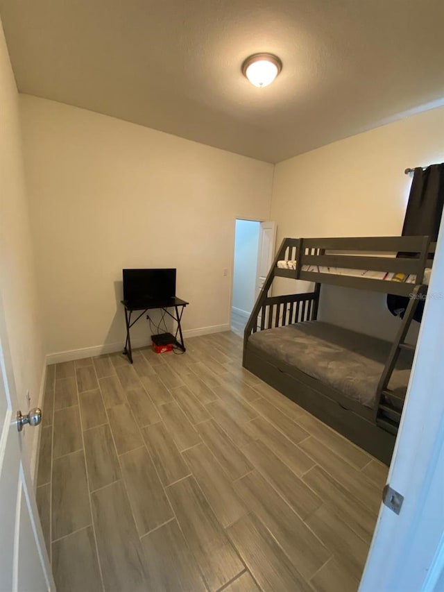 2408 Conroy Ave N, Lehigh Acres, FL 33971 - bedroom featuring wood finished floors and baseboards