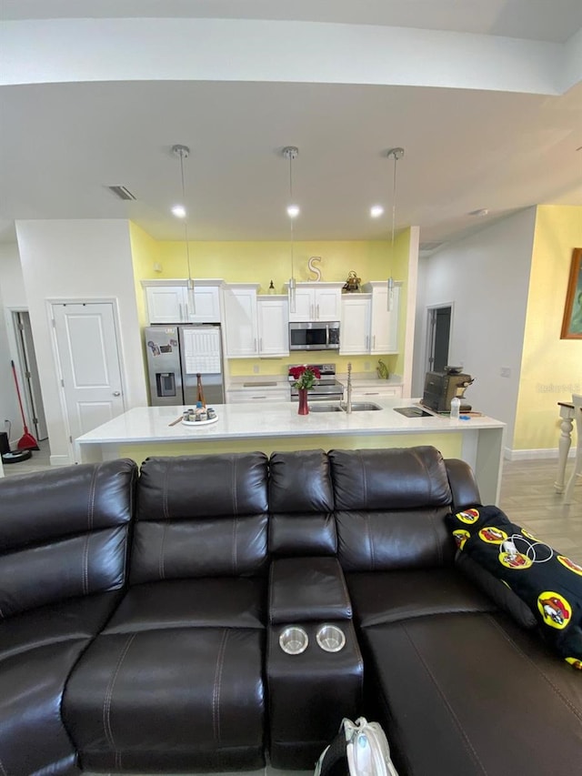2408 Conroy Ave N, Lehigh Acres, FL 33971 - living room featuring baseboards