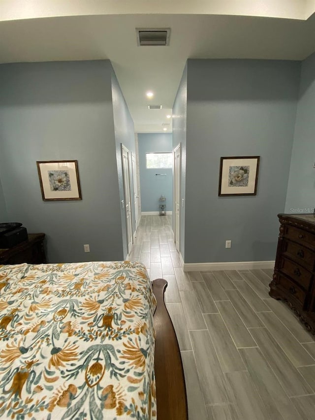 2408 Conroy Ave N, Lehigh Acres, FL 33971 - bedroom with wood tiled floors and recessed lighting