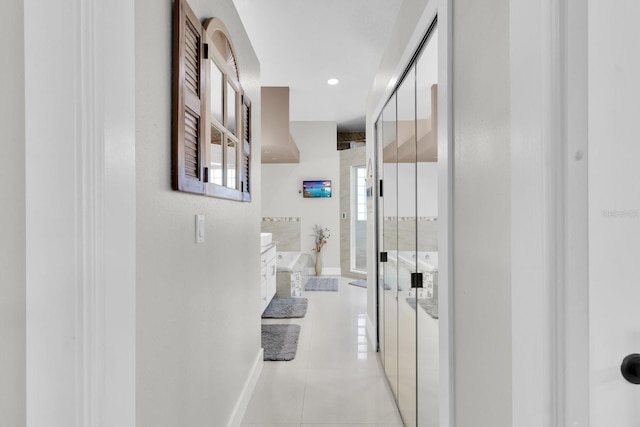 2402 Raven Croft Ct, Orlando, FL 32837 - hall featuring light tile patterned floors and healthy amount of natural light