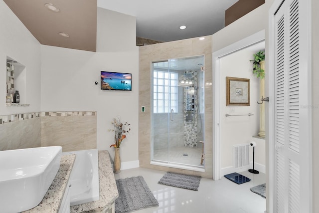 2402 Raven Croft Ct, Orlando, FL 32837 - full bathroom featuring a closet, a shower stall, recessed lighting, and vanity