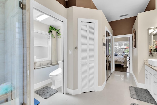2402 Raven Croft Ct, Orlando, FL 32837 - bathroom featuring a closet, vanity, a shower stall, and ensuite bath