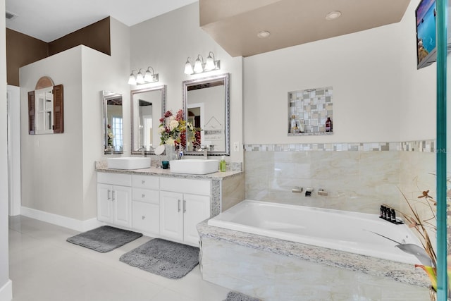2402 Raven Croft Ct, Orlando, FL 32837 - bathroom featuring double vanity, tile patterned floors, and a garden tub