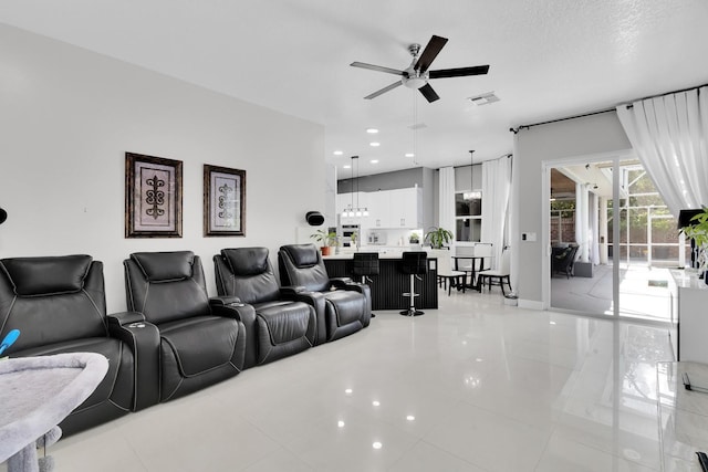 2402 Raven Croft Ct, Orlando, FL 32837 - cinema room featuring ceiling fan, light tile patterned flooring, and recessed lighting