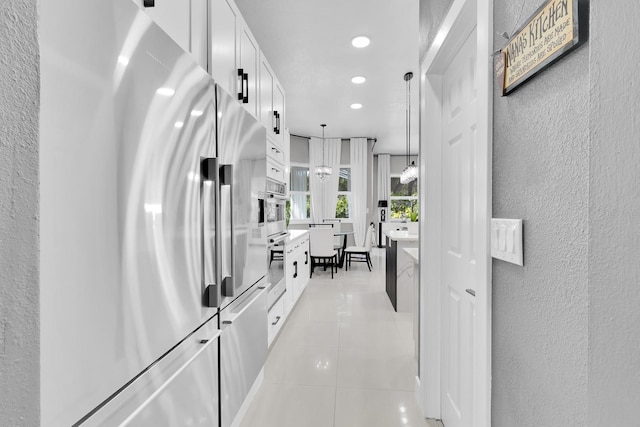 2402 Raven Croft Ct, Orlando, FL 32837 - hallway featuring light tile patterned floors, recessed lighting, and a textured wall