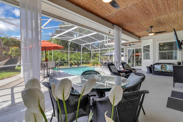 2402 Raven Croft Ct, Orlando, FL 32837 - view of patio featuring a ceiling fan, outdoor dining space, an outdoor pool, and glass enclosure