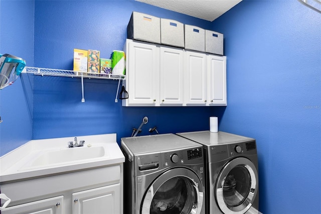 716 Timberwilde Ave, Winter Springs, FL 32708 - laundry area featuring cabinet space, washing machine and clothes dryer, and a textured wall